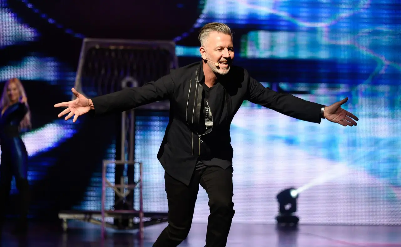 John Taylor performing live for a theatre audience