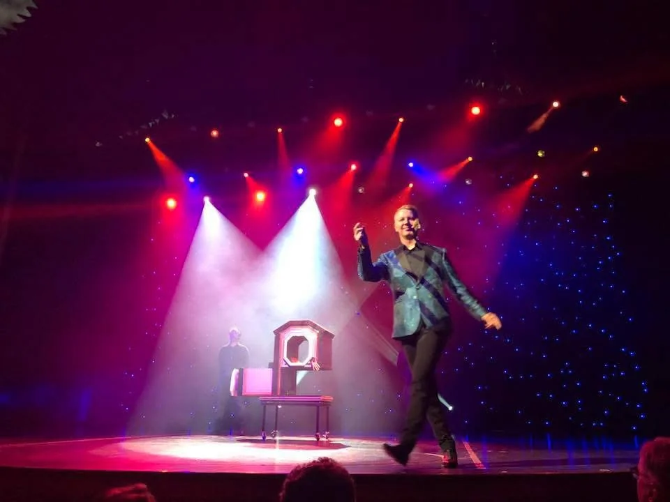 John Taylor presenting a comedy magic stage show
